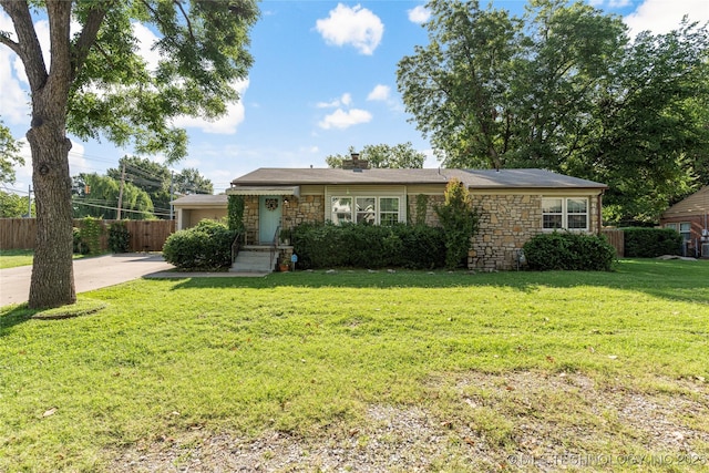 1640 E 41st St, Tulsa, OK 74105 - view of front of house with stone siding, a chimney, and concrete driveway