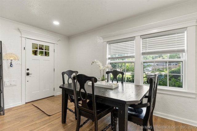 1640 E 41st St, Tulsa, OK 74105 - dining space with healthy amount of natural light, light wood-style flooring, ornamental molding, and a textured wall
