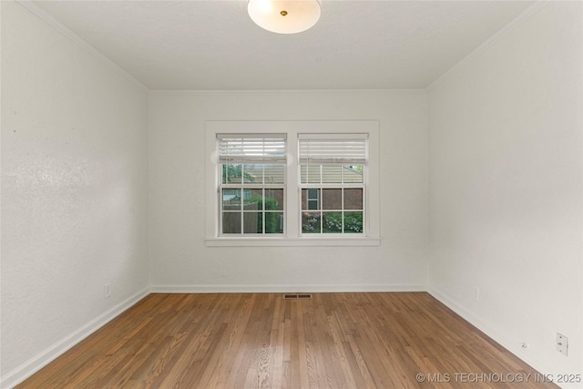 1640 E 41st St, Tulsa, OK 74105 - spare room featuring wood finished floors and ornamental molding