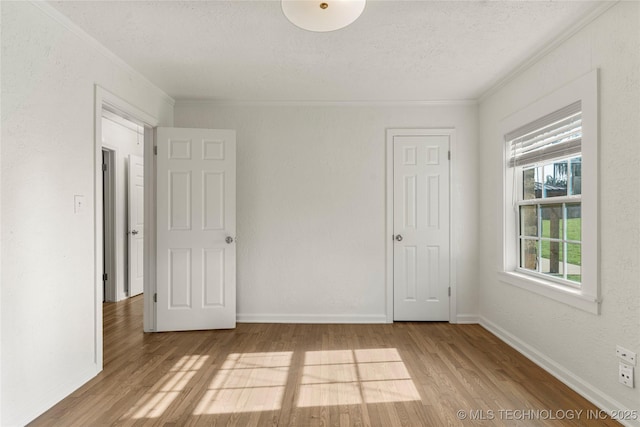 1640 E 41st St, Tulsa, OK 74105 - unfurnished room with wood finished floors, ornamental molding, and a textured ceiling