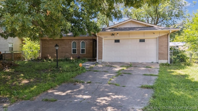 12131 E 32nd Pl, Tulsa, OK 74146 - ranch-style house featuring concrete driveway, brick siding, and an attached garage