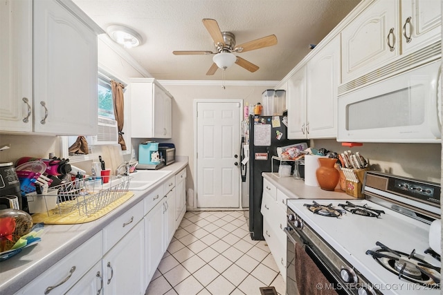 12131 E 32nd Pl, Tulsa, OK 74146 - kitchen featuring white appliances, ceiling fan, white cabinets, light countertops, and light tile patterned flooring