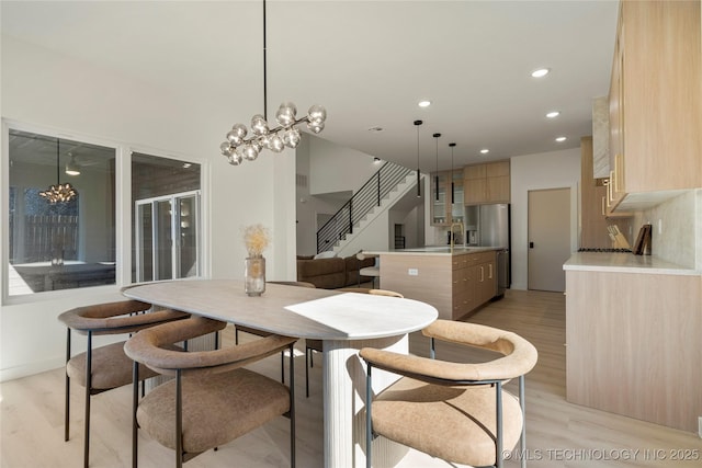 1732 S Jamestown Ave, Tulsa, OK 74112 - dining space featuring a chandelier, light wood finished floors, recessed lighting, and stairs