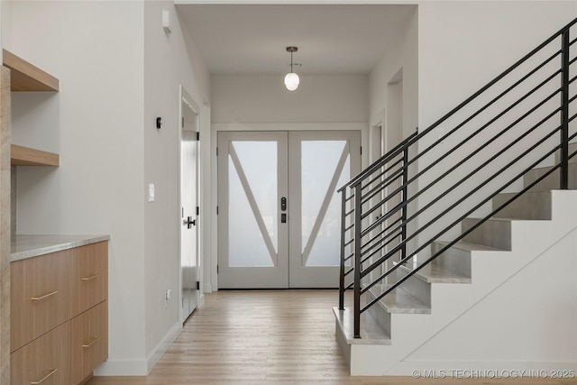 1732 S Jamestown Ave, Tulsa, OK 74112 - foyer featuring light wood-style floors, stairs, and french doors