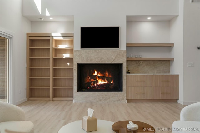 1732 S Jamestown Ave, Tulsa, OK 74112 - living room with wood finished floors, a fireplace, and a skylight