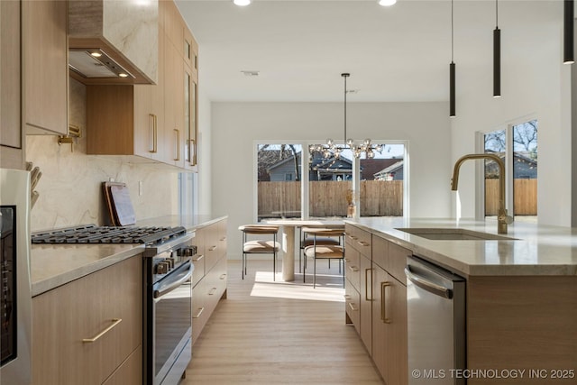 1732 S Jamestown Ave, Tulsa, OK 74112 - kitchen featuring stainless steel appliances, wall chimney range hood, modern cabinets, healthy amount of natural light, and recessed lighting
