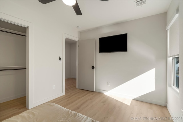 1732 S Jamestown Ave, Tulsa, OK 74112 - unfurnished bedroom with wood finished floors, a closet, and ceiling fan