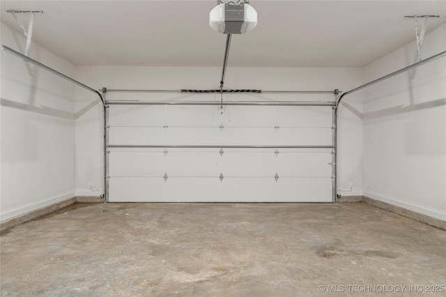 1732 S Jamestown Ave, Tulsa, OK 74112 - garage featuring a garage door opener and baseboards