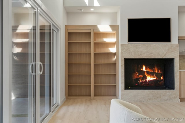 1732 S Jamestown Ave, Tulsa, OK 74112 - unfurnished bedroom with wood finished floors and a high end fireplace