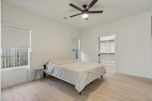 1732 S Jamestown Ave, Tulsa, OK 74112 - bedroom with wood finished floors, a ceiling fan, and a spacious closet