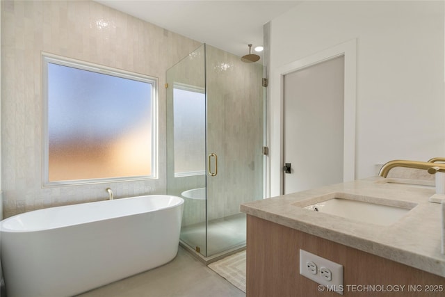 1732 S Jamestown Ave, Tulsa, OK 74112 - full bath featuring healthy amount of natural light, a stall shower, double vanity, and a freestanding tub
