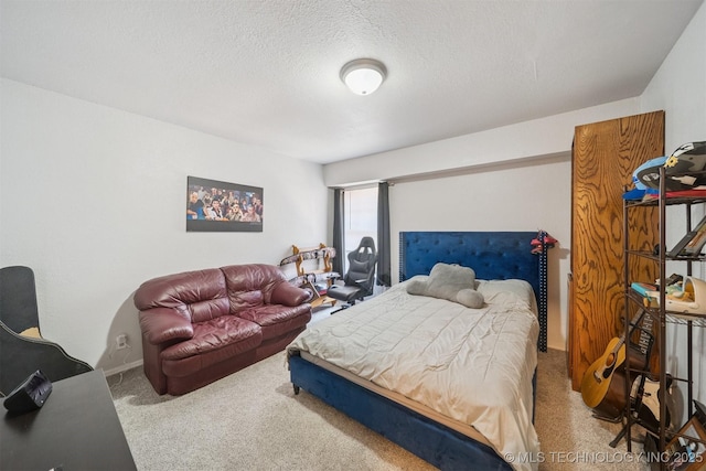 6376 S 80th E Ave Unit G, Tulsa, OK 74133 - carpeted bedroom featuring baseboards and a textured ceiling