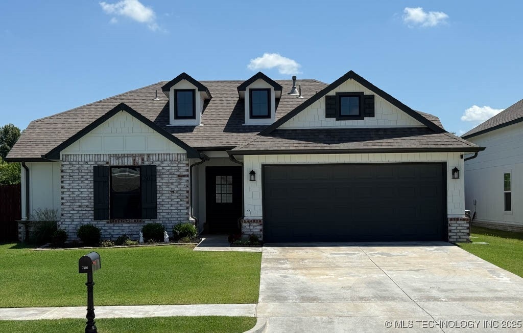 7416 E 87th St, Owasso, OK 74055 - view of front of home with concrete driveway, a front yard, a shingled roof, a garage, and brick siding