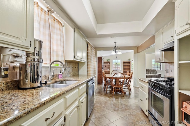 1508 Melissa Cir, Sapulpa, OK 74066 - kitchen featuring stainless steel appliances, tasteful backsplash, under cabinet range hood, and light tile patterned flooring