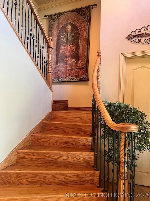 910 Summit Rdg, Mcalester, OK 74501 - stairway with wood finished floors and baseboards