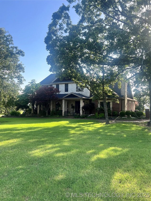 910 Summit Rdg, Mcalester, OK 74501 - view of front of house featuring a front lawn