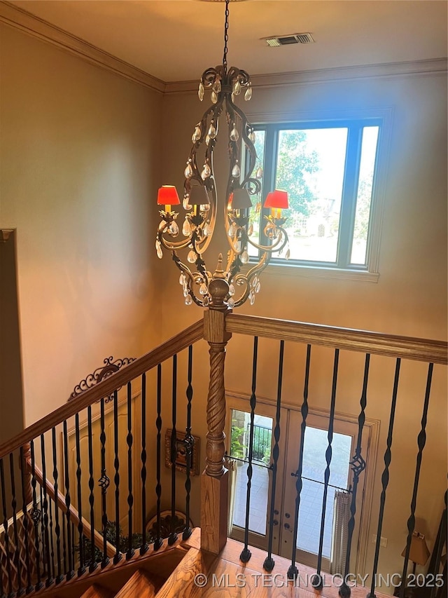 910 Summit Rdg, Mcalester, OK 74501 - stairs with a chandelier and ornamental molding