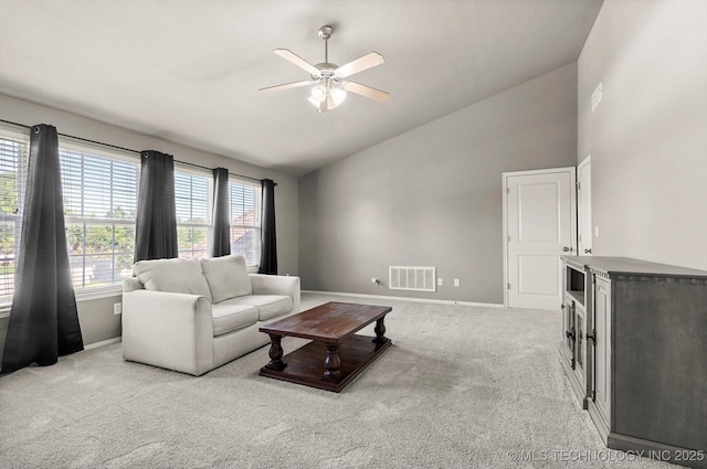 7185 N 194th E Ave, Owasso, OK 74055 - carpeted living room with ceiling fan and high vaulted ceiling