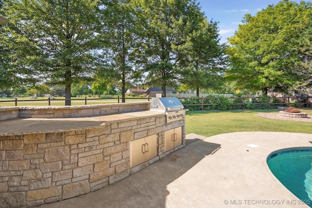 7185 N 194th E Ave, Owasso, OK 74055 - view of patio featuring area for grilling and an outdoor fire pit