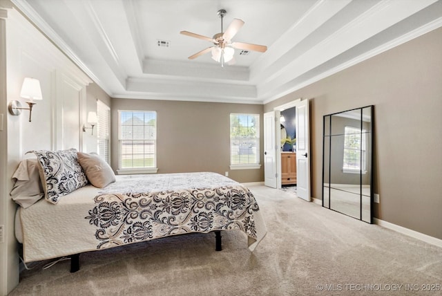 7185 N 194th E Ave, Owasso, OK 74055 - carpeted bedroom featuring a raised ceiling, ornamental molding, a ceiling fan, and connected bathroom