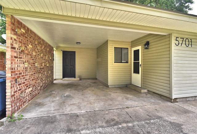 5701 S Rockford Pl, Tulsa, OK 74105 - view of exterior entry with a carport