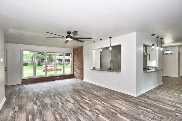5701 S Rockford Pl, Tulsa, OK 74105 - unfurnished living room featuring dark wood-style floors and a ceiling fan