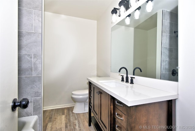 5701 S Rockford Pl, Tulsa, OK 74105 - full bath with vanity and wood finished floors