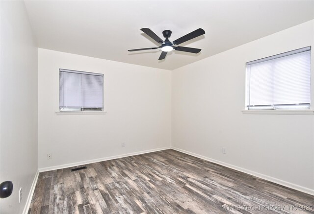 5701 S Rockford Pl, Tulsa, OK 74105 - unfurnished room with wood finished floors and ceiling fan