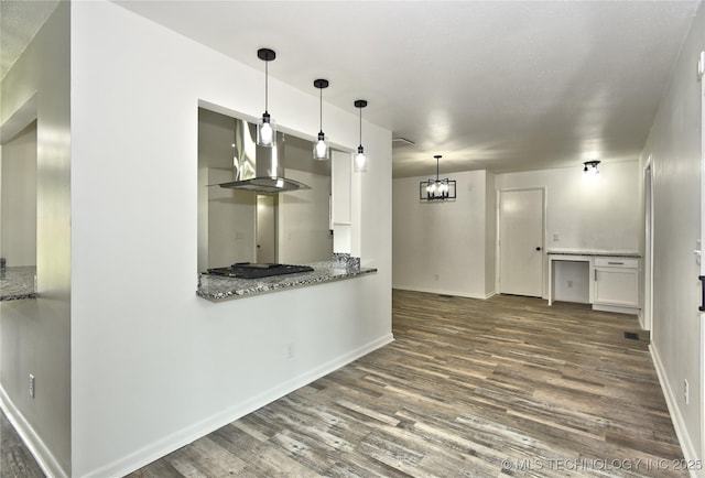 5701 S Rockford Pl, Tulsa, OK 74105 - kitchen featuring dark wood-style flooring, hanging light fixtures, white cabinets, and stone counters