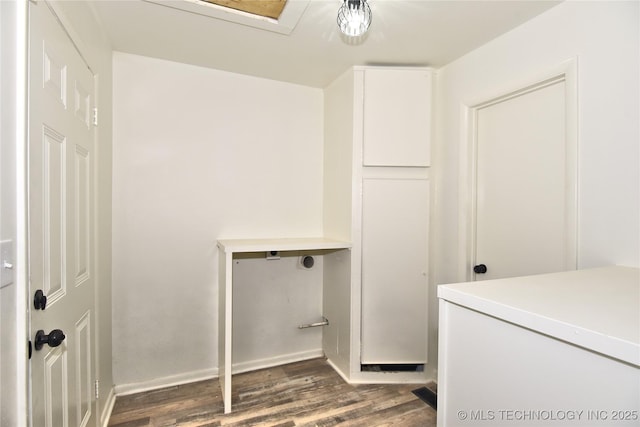 5701 S Rockford Pl, Tulsa, OK 74105 - washroom featuring dark wood finished floors and baseboards