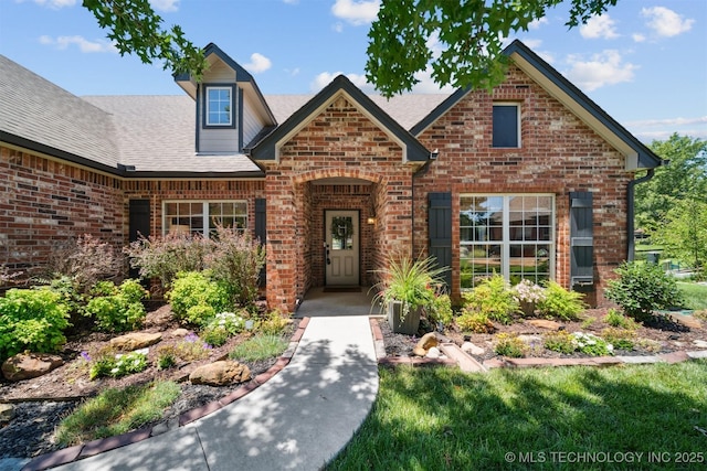 14003 E 87th Pl N, Owasso, OK 74055 - view of front of property featuring brick siding and roof with shingles