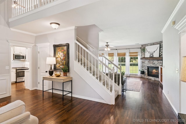 14003 E 87th Pl N, Owasso, OK 74055 - stairway with wood finished floors, ceiling fan, ornamental molding, and a stone fireplace