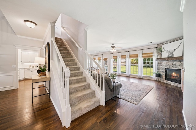 14003 E 87th Pl N, Owasso, OK 74055 - stairway with ceiling fan, a stone fireplace, crown molding, and wood finished floors