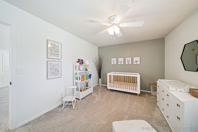 14003 E 87th Pl N, Owasso, OK 74055 - bedroom featuring light carpet, a nursery area, and a ceiling fan