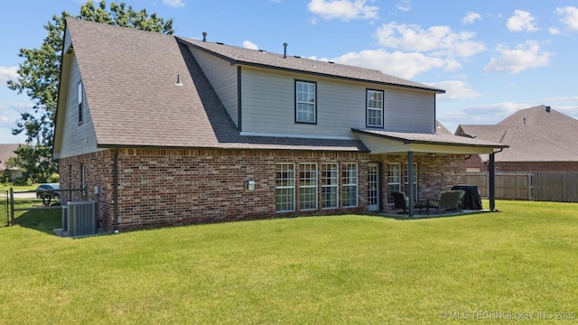14003 E 87th Pl N, Owasso, OK 74055 - back of property featuring a fenced backyard, brick siding, and a patio