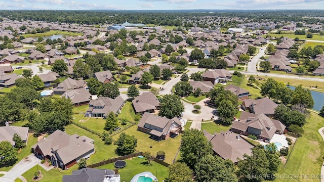 14003 E 87th Pl N, Owasso, OK 74055 - aerial view of property's location with nearby suburban area and a nearby body of water