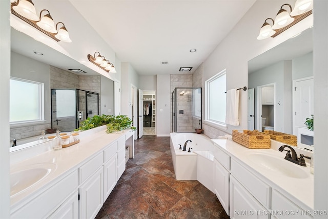 14003 E 87th Pl N, Owasso, OK 74055 - bathroom featuring two vanities, plenty of natural light, and a shower stall