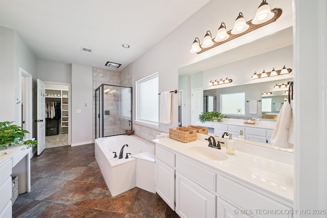 14003 E 87th Pl N, Owasso, OK 74055 - bathroom featuring a shower stall, vanity, a bath, and a spacious closet