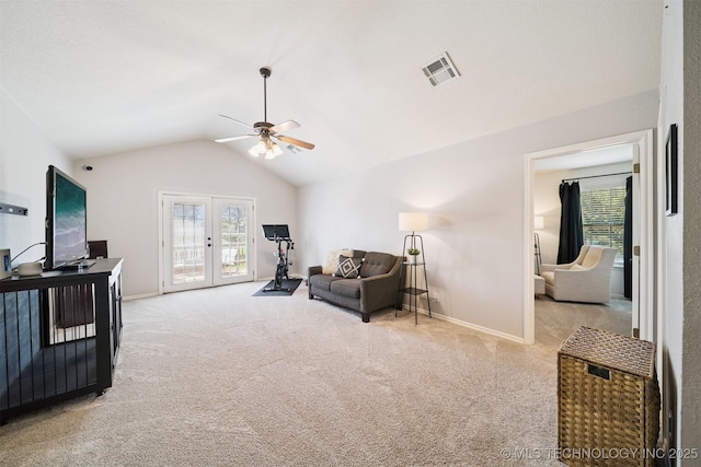 14003 E 87th Pl N, Owasso, OK 74055 - living area with carpet, a ceiling fan, lofted ceiling, healthy amount of natural light, and french doors