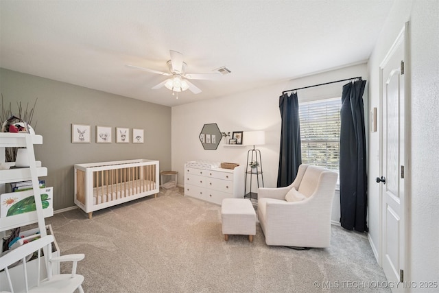14003 E 87th Pl N, Owasso, OK 74055 - bedroom with carpet, a nursery area, and a ceiling fan