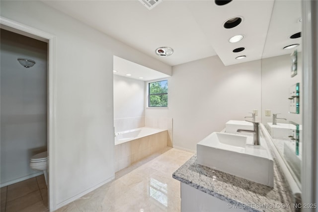 8912 S 70th E Ave, Tulsa, OK 74133 - full bathroom featuring a garden tub and double vanity