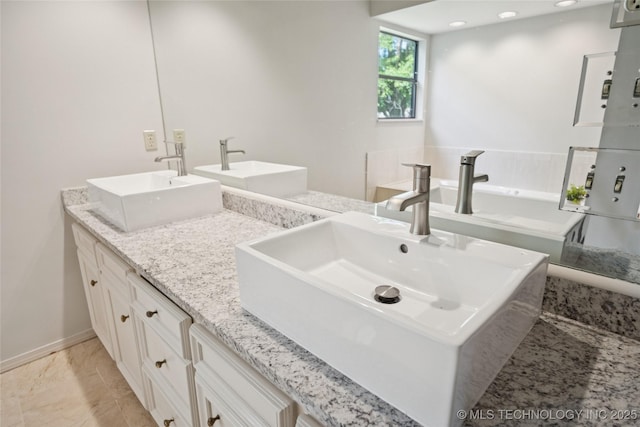 8912 S 70th E Ave, Tulsa, OK 74133 - full bathroom with double vanity and marble finish floors