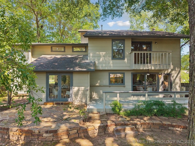 8912 S 70th E Ave, Tulsa, OK 74133 - back of house with a balcony, french doors, a patio area, and roof with shingles