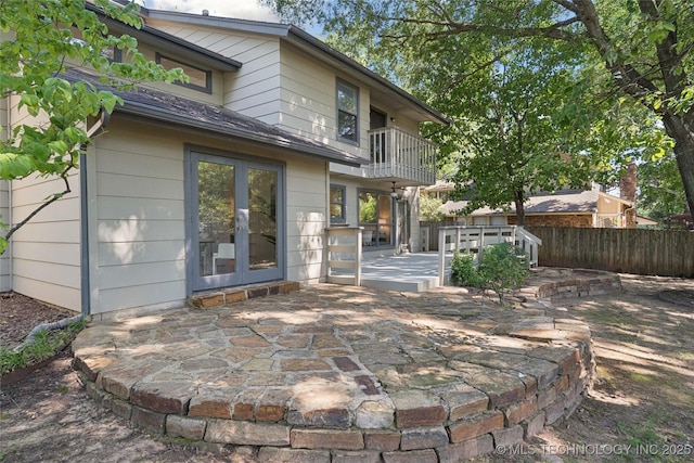 8912 S 70th E Ave, Tulsa, OK 74133 - rear view of property with a balcony, french doors, a patio area, and roof with shingles