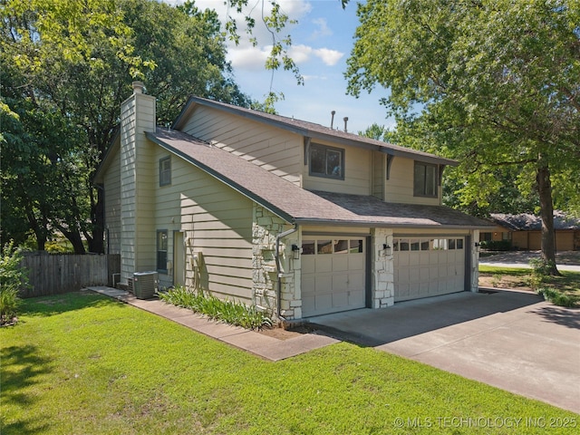 8912 S 70th E Ave, Tulsa, OK 74133 - view of front of house with concrete driveway, a chimney, roof with shingles, an attached garage, and stone siding