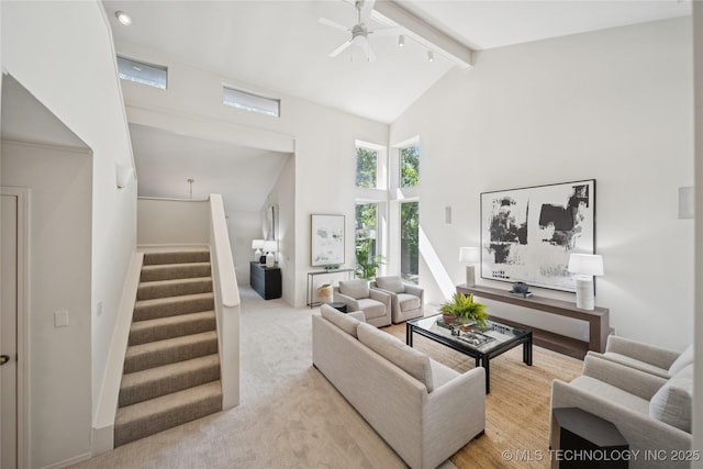 8912 S 70th E Ave, Tulsa, OK 74133 - living area featuring ceiling fan, high vaulted ceiling, beamed ceiling, stairway, and light carpet