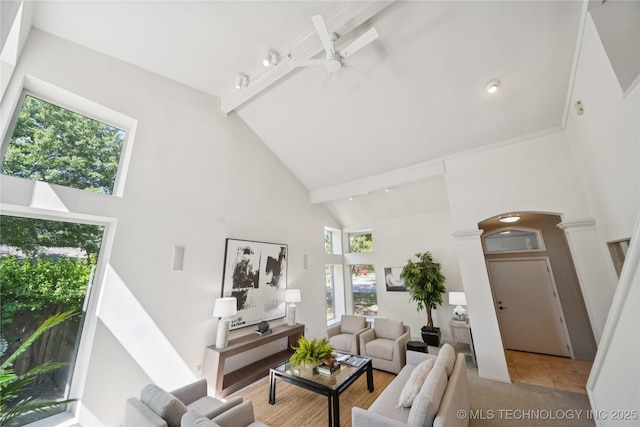 8912 S 70th E Ave, Tulsa, OK 74133 - living room featuring high vaulted ceiling, arched walkways, a ceiling fan, beamed ceiling, and decorative columns