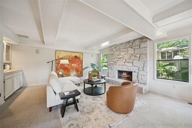 8912 S 70th E Ave, Tulsa, OK 74133 - carpeted living area featuring beamed ceiling and a stone fireplace