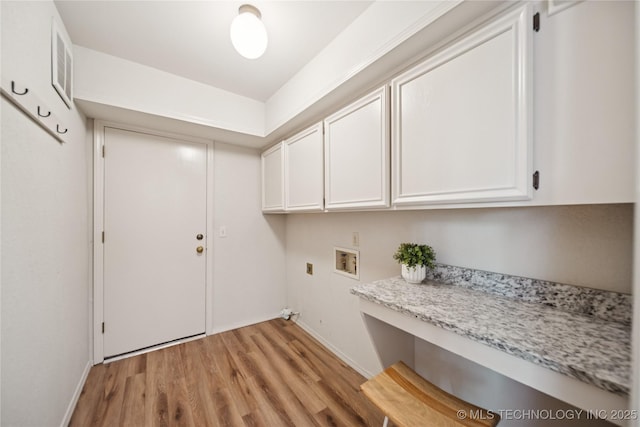8912 S 70th E Ave, Tulsa, OK 74133 - laundry area featuring cabinet space, washer hookup, and light wood-style flooring