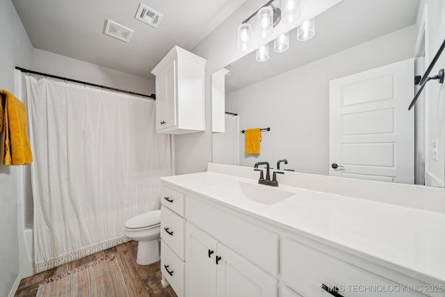 7413 N 160th E Ave, Owasso, OK 74055 - bathroom featuring vanity, wood finished floors, and shower / bath combination with curtain